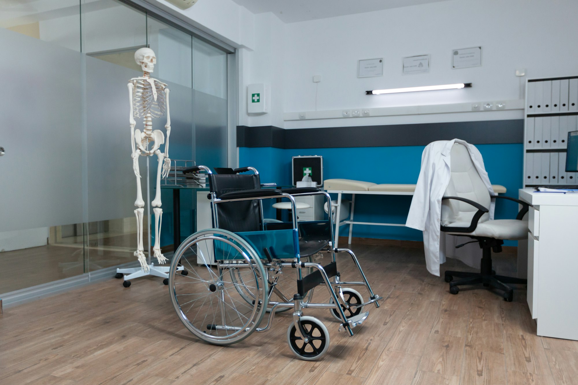 Medical wheelchair for invalid patient standing in empty doctor office